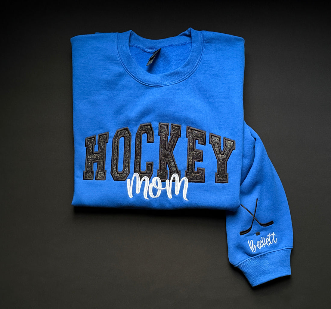 Hockey Mom Glitter Embroidered Sweatshirt w/ Name and Hockey Sticks on Sleeve