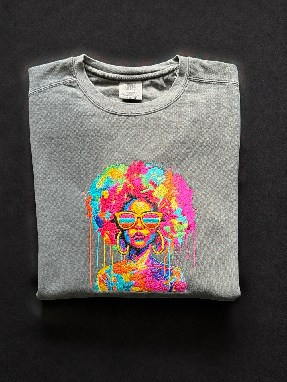 Gray Comfort Colors sweatshirt with original colorful embroidered woman wearing sunglasses